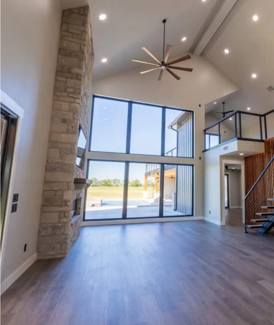 Modern living room with large windows.
