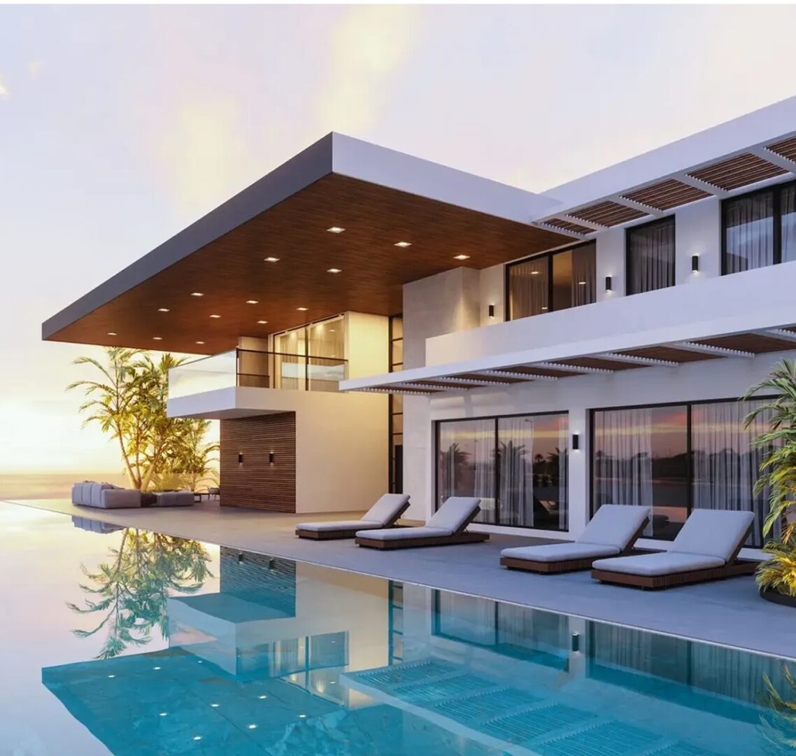 Modern luxury house with pool at sunset.