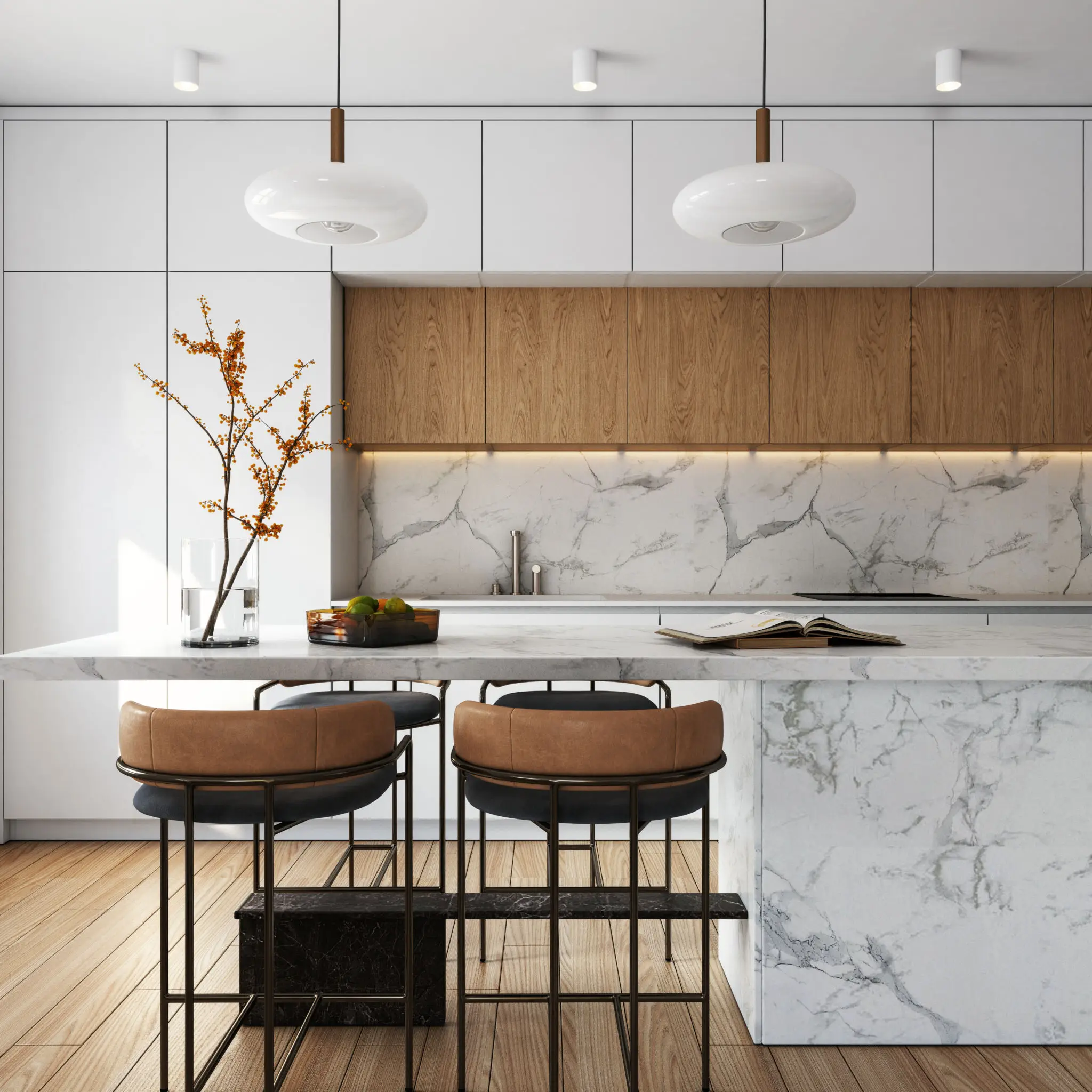 Modern kitchen with marble island and stools.