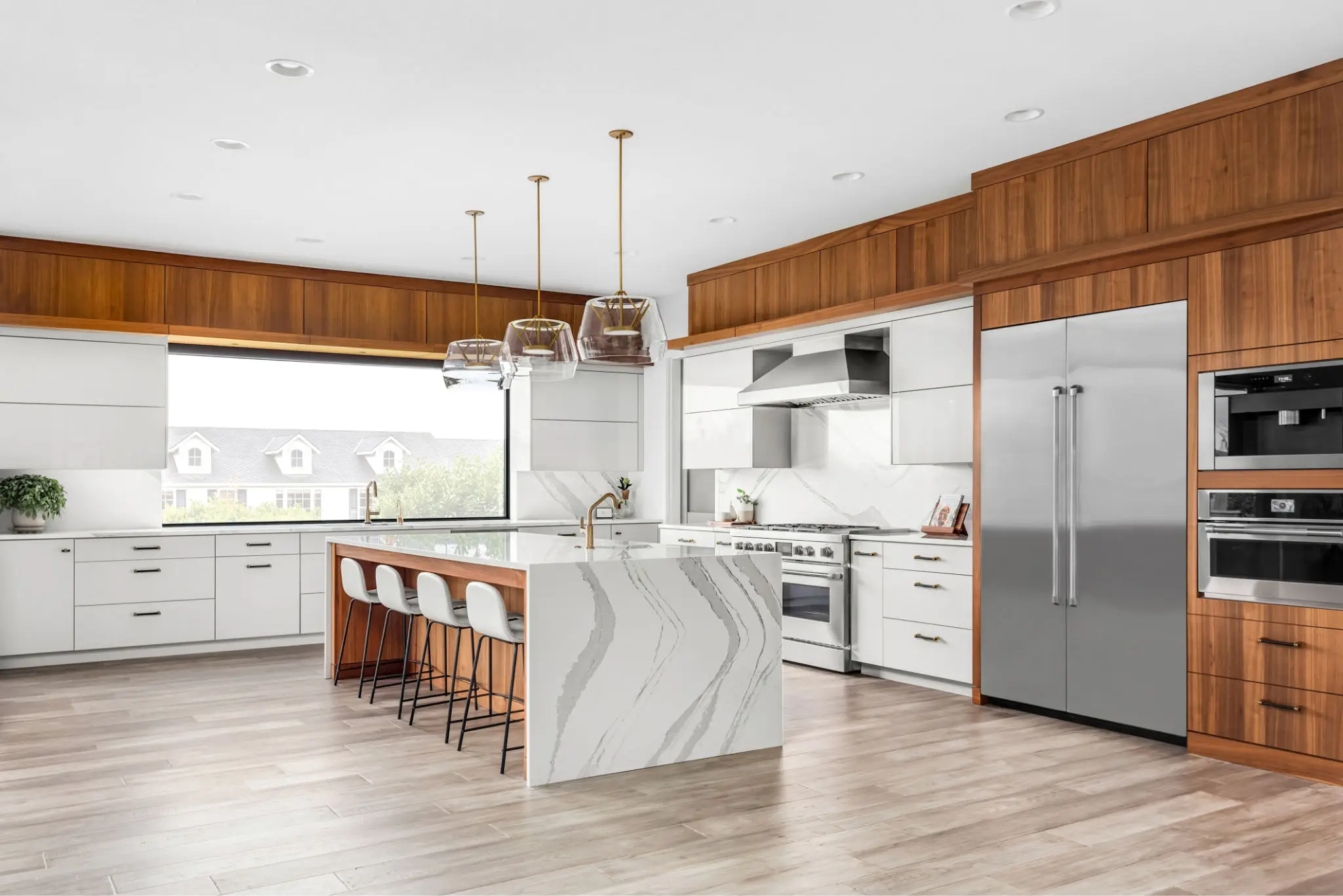 Modern kitchen with island and wooden accents.