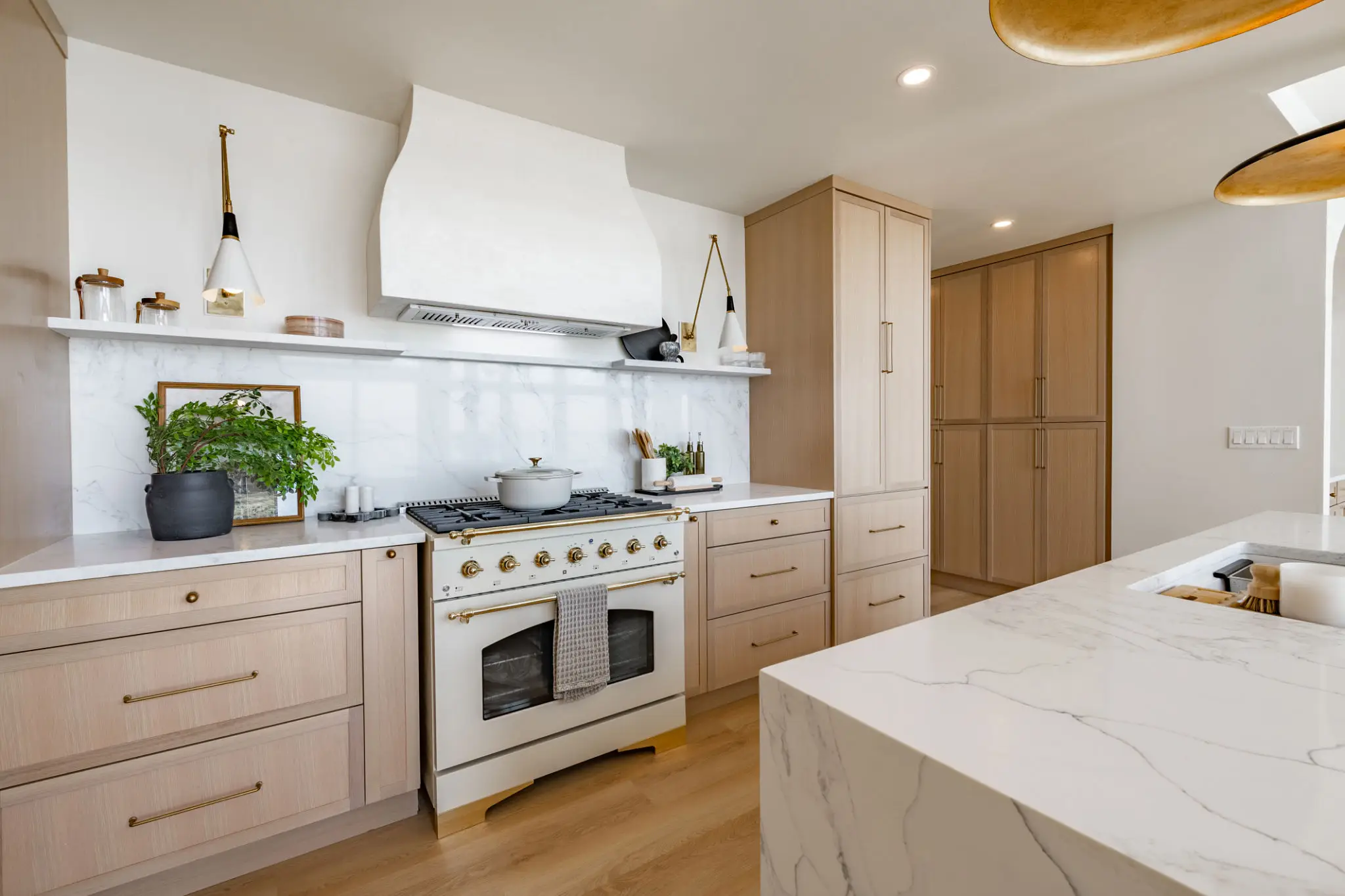 Modern kitchen with wooden cabinets and stove.